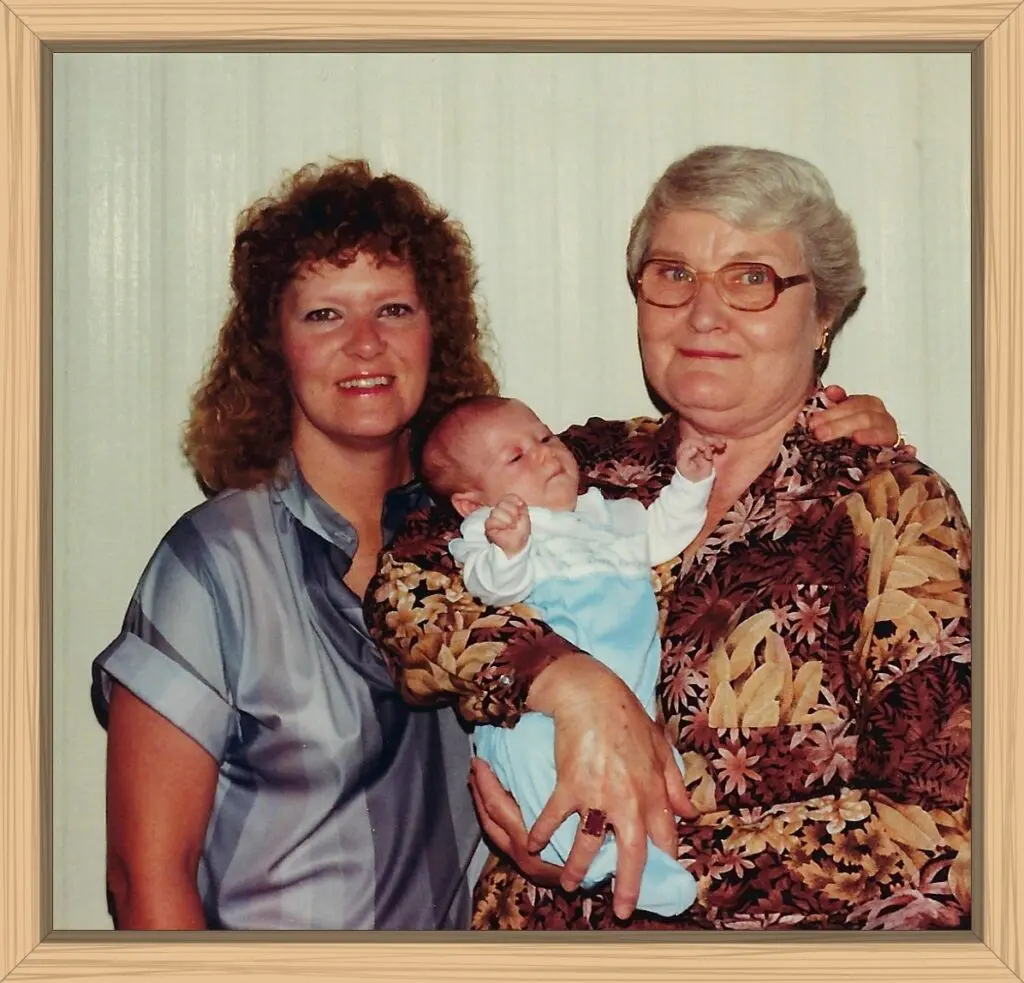 Me, Hayes, and my mom posing for a photo-op in front of our mobile home.