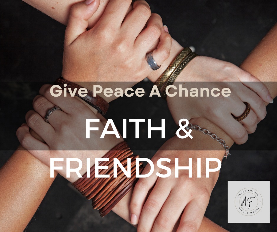 Four hands of friendship embracing one another.