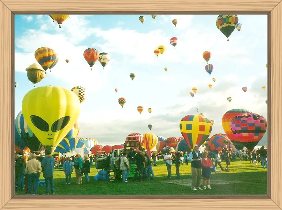 At the Balloon Park during a Mass Ascension with many balloons waiting to launch and many already in the air. The Alien Balloon looked like it was posing for me.
