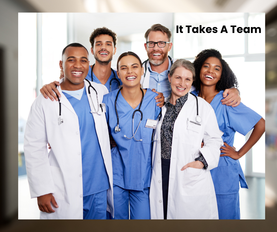 A team of six doctors standing together. Three are women and three are men.