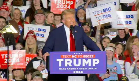 Donald Trump with a young crowd behind him during a 2024 rally.