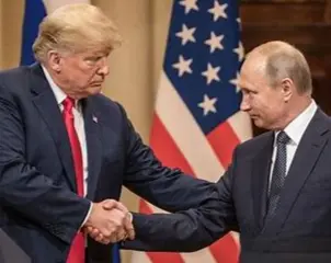 Donald Trump and Vladimir Putin looking into each other's eyes. and Trump has his left hand under Putin's right arm while they are shaking hands. The photo has an eerie look to it in my opinion.